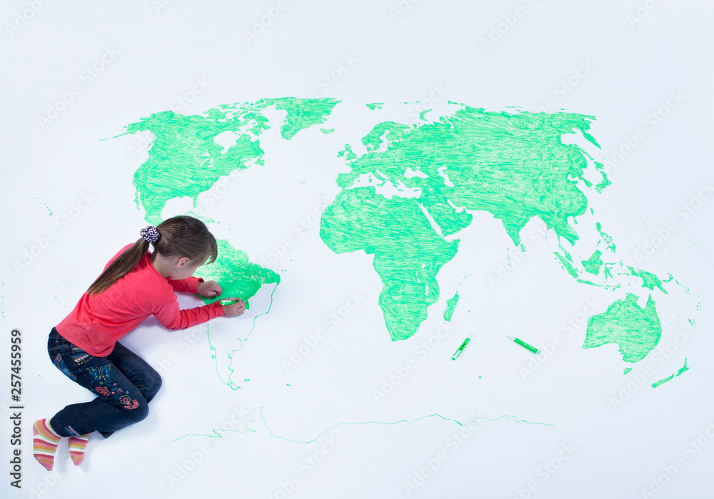 Top view of young girl drawing a map of the world Stock Photo | Adobe Stock
