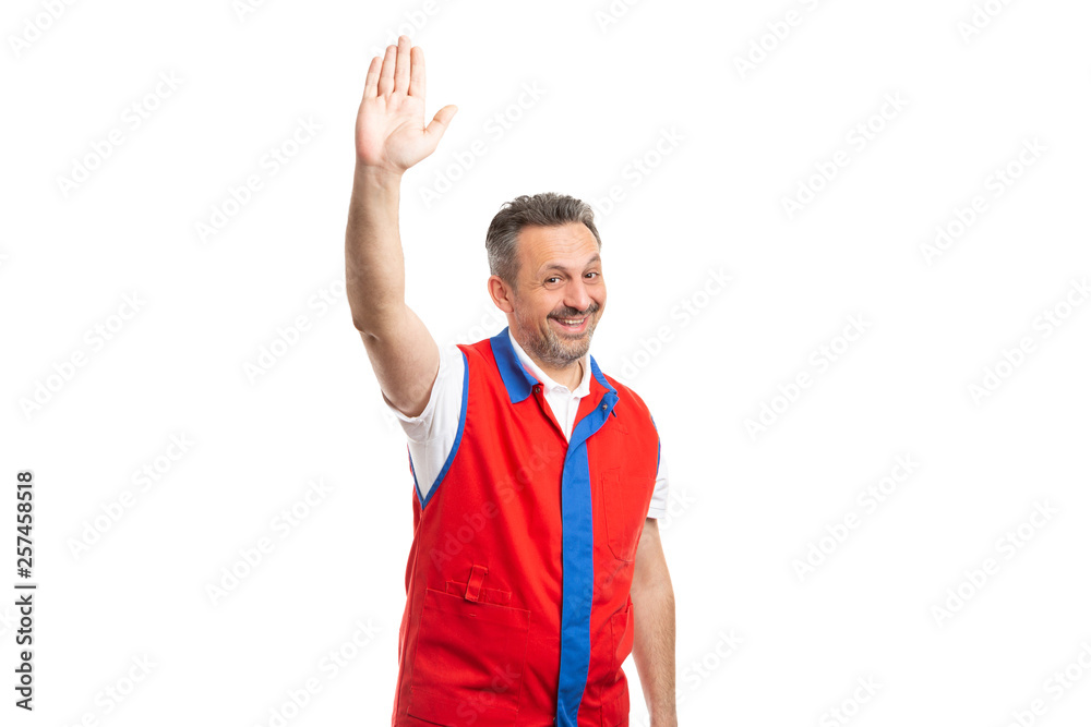 Supermarket worker with palm up as hello gesture. Supermarket worker with palm up as hello gesture.