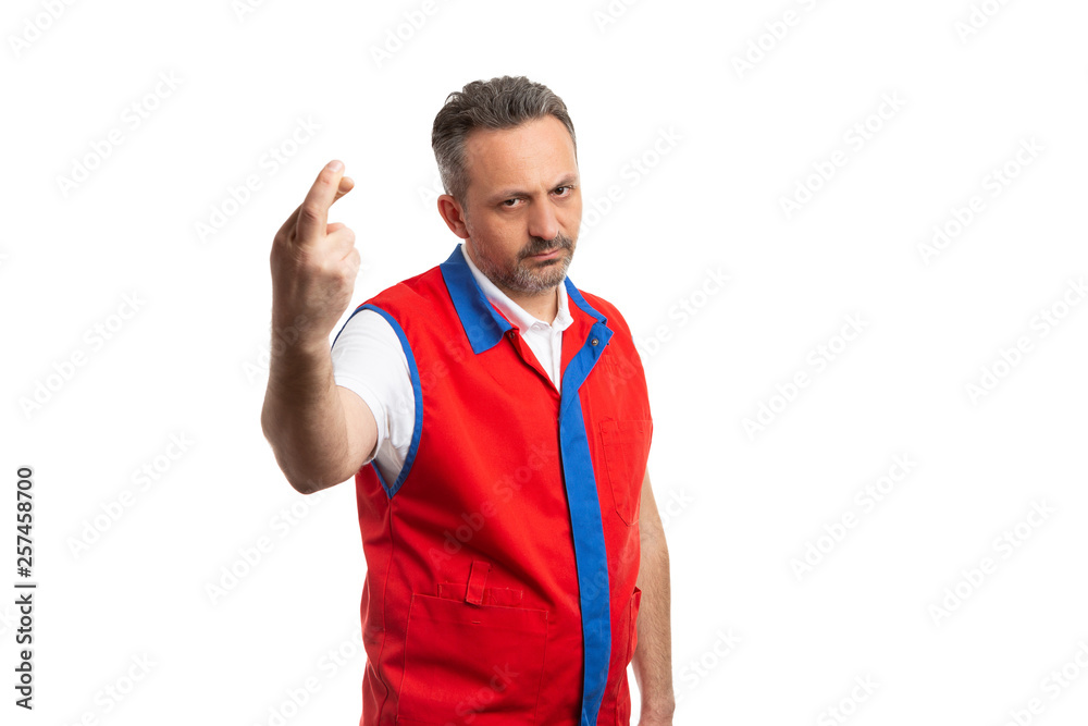 Supermarket employee holding fingers crossed with angry expression. Supermarket employee holding fingers crossed with angry expression.