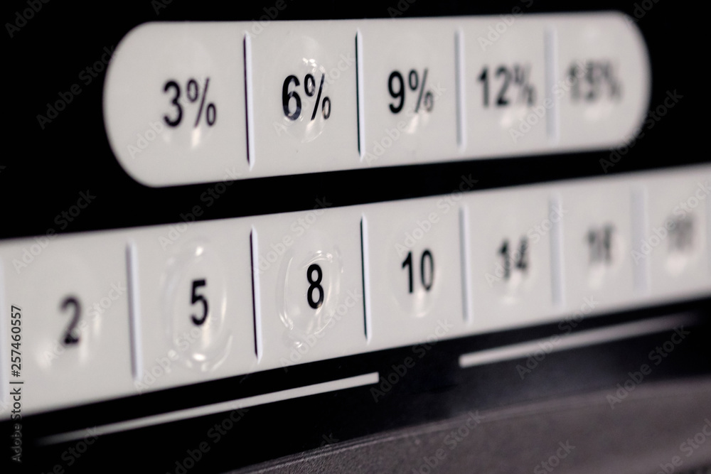 White buttons with numbers on on a white background, design elements, selective focus White buttons with numbers on on a white background, design elements, selective focus
