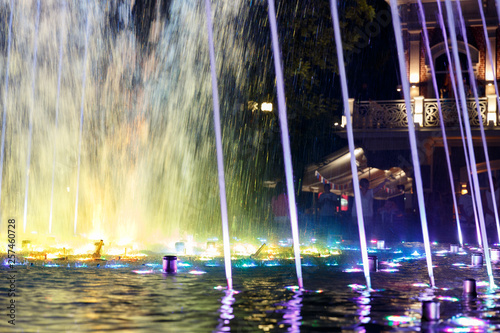 Beautiful, colorful, musical, fountain in the city of Krasnodar on the background of the central avenue