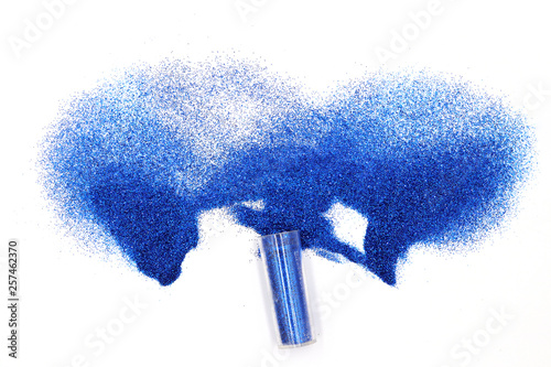 Jar with spilled Blue  glitter Magical, celestial blue glitter spilling out of a jar isolated on white background