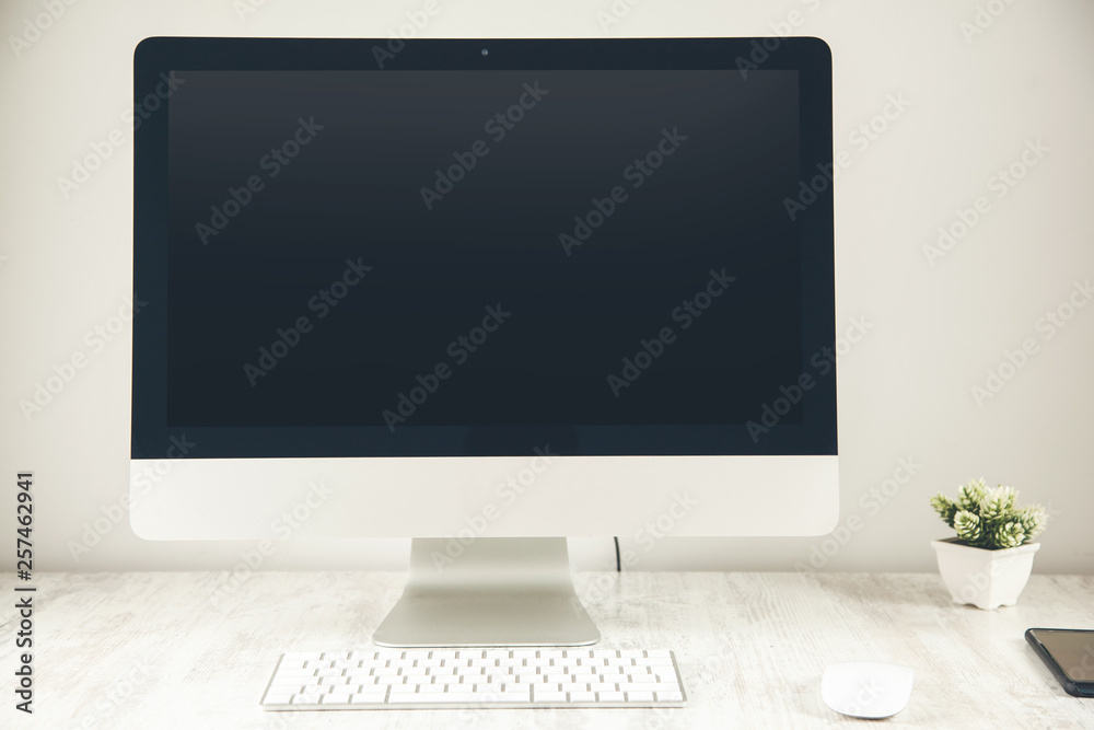 white computer on the wooden desk white computer on the wooden desk