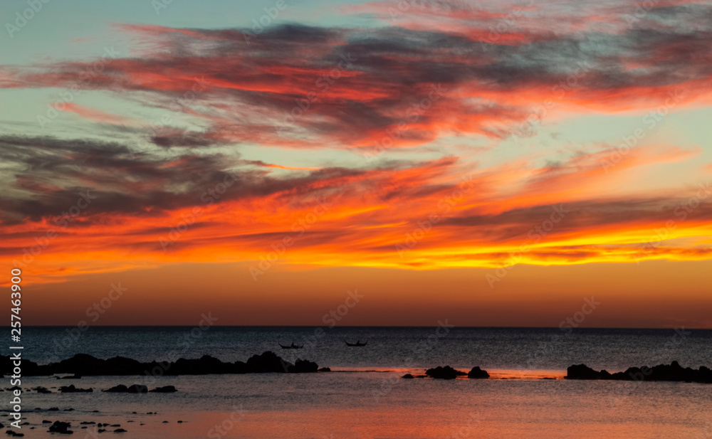 Orange sunset on sea with boats Orange sunset on sea with boats