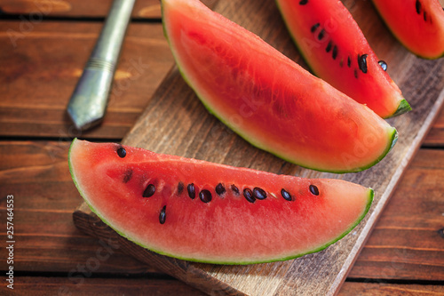 Fresh ripe sliced watermelon on wooden  background 