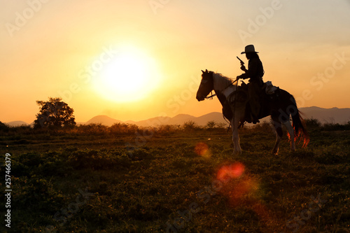 cowboy and horse  at first light,mountain, river and lifestyle with natural sunset light background