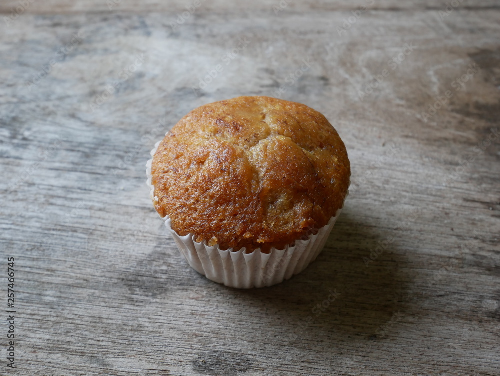 muffins on wooden table,homemade sweet cake muffins on wooden table,homemade sweet cake