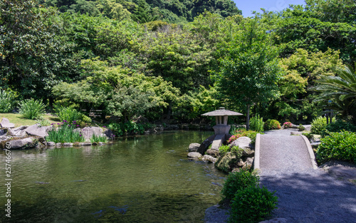 Japanese Garden covered by green Landscape. Taken in the wonderful Sengan-en Garden. Located in Kagoshima, Kyushu, South of Japan. photo