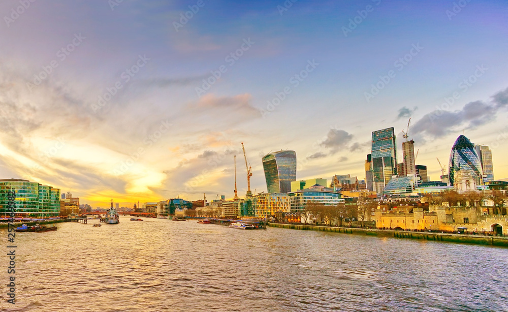 Panorama of London skyline and River Thames at sunset.
