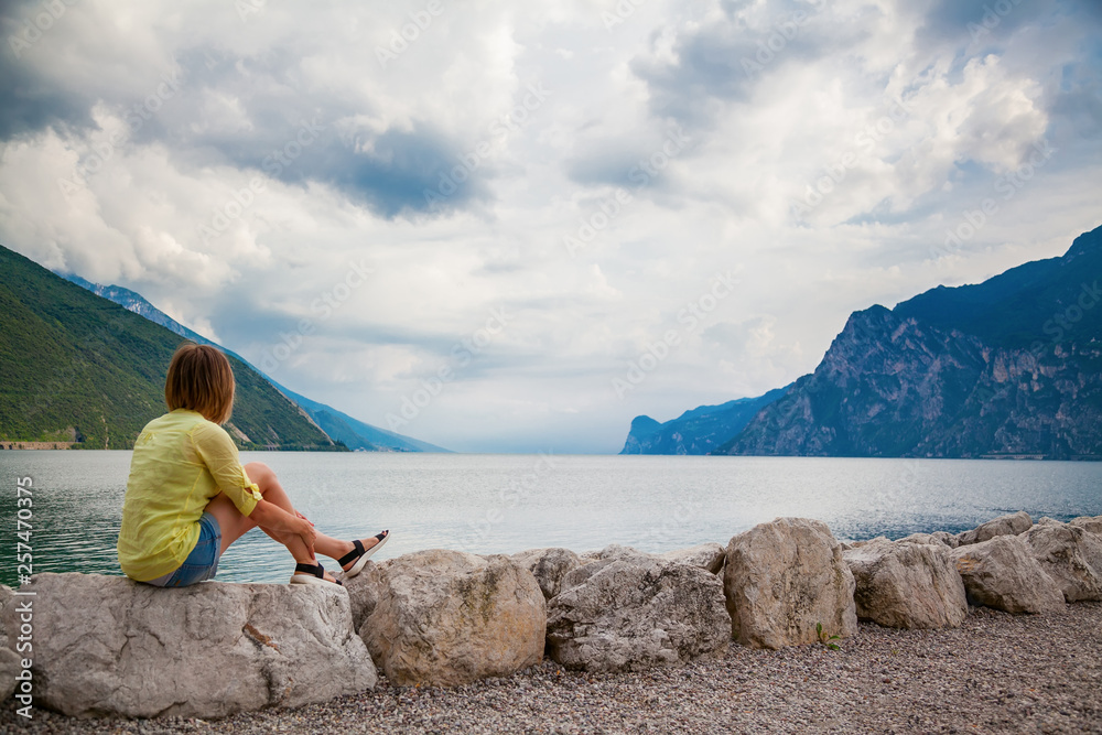 woman looking at the beautiful Garda lake