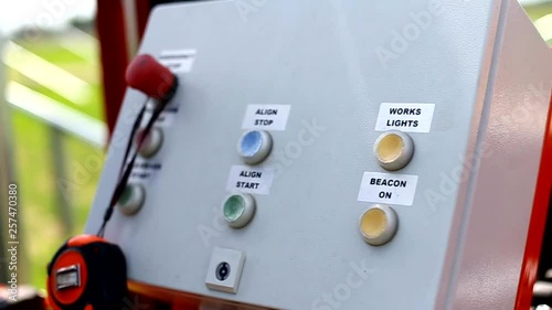 Pillar driving of hydraulic drilling or hammer machines on construction site. Worker operate pillars machine. Building solar power station.