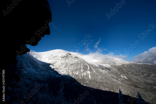 Ian Austin and Joe Klementovich hike the Boott Spur Link to the Trail proper as a winter storm clears affording great views of Tuckerman's Ravine and the summit cone of Mt. Washington. photo