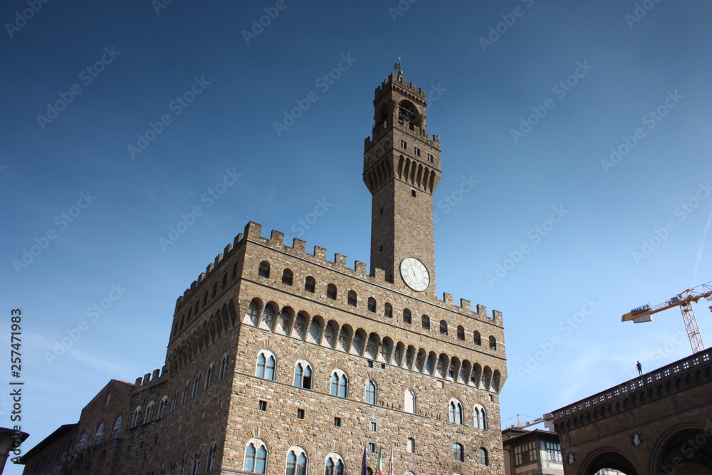 Facade of the Florentine Palace in Piazza della Signoria on a spring day