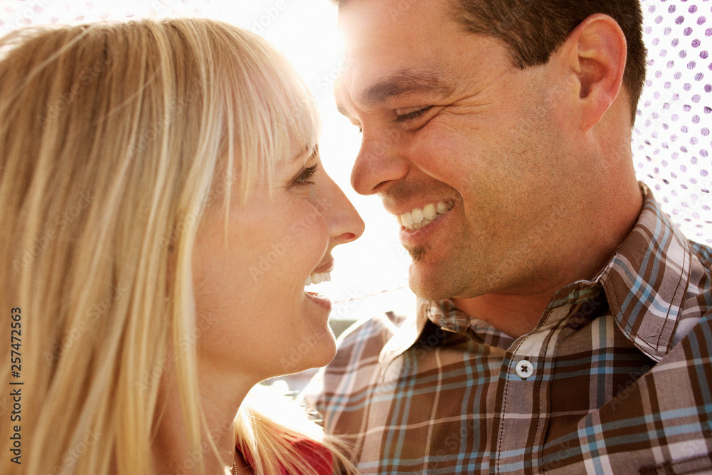 Couple smiling and looking at each other Couple smiling and looking at each other