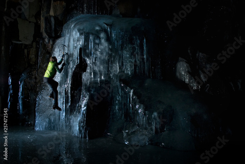 Finding the only ice in town in an abandoned tunnel, Joel Oberly, practices some ice climbing techniques in Truckee, California.