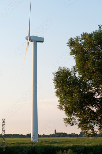 A wind turbine amidst the Dutch Countryside photo