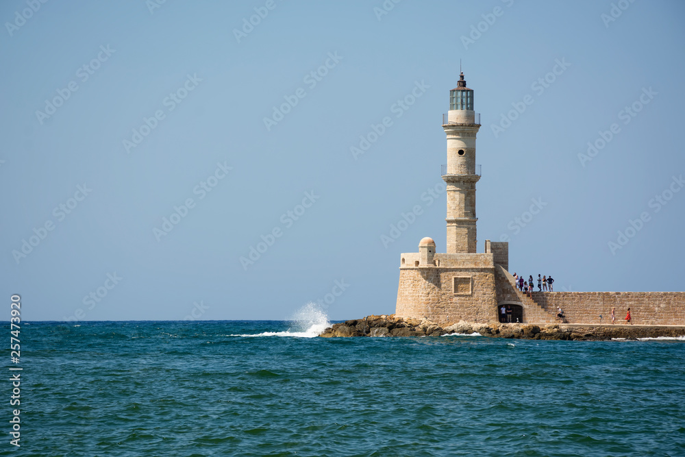 Lighthouse in the Venetian Harbor in Chania Old Town. Crete island of Greece