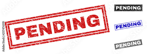 Grunge PENDING rectangle stamp seals isolated on a white background. Rectangular seals with grunge texture in red, blue, black and gray colors.