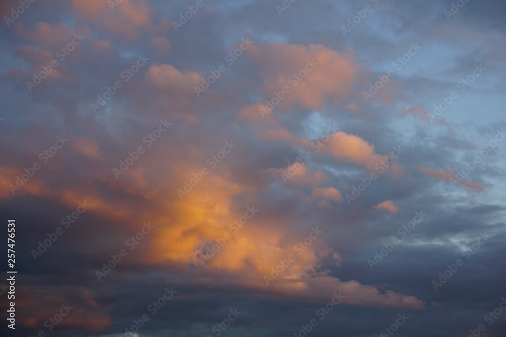 dramatic blue sky with orange clouds