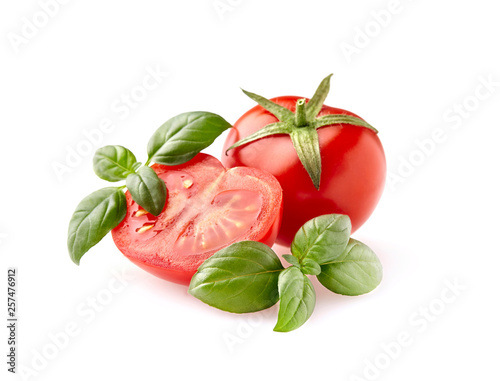 Fresh tomato and basil leaf isolated on white