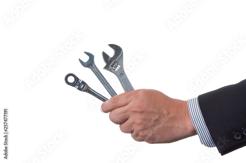 Mechanic engineer holding many kind of wrench in his hand; handing tool on white background with clipping path