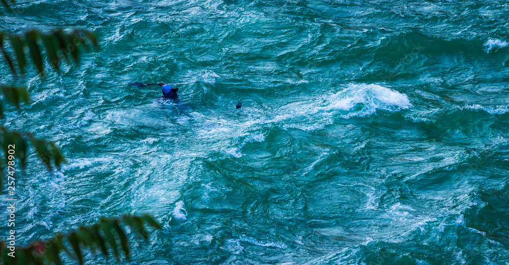 man drowning  as losing balance while kayaking 