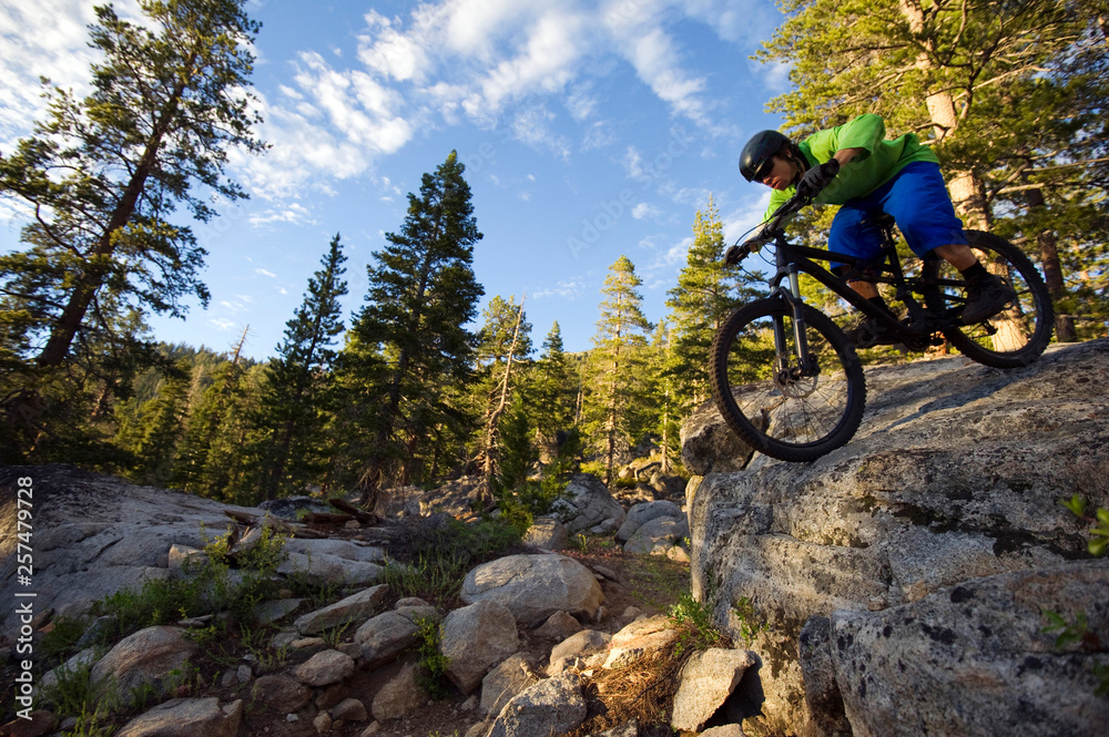 Man mountain biking on Scott's Lake trail Man mountain biking on Scott's Lake trail