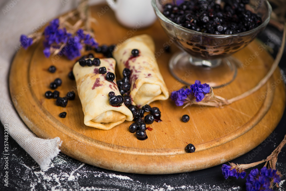 sweet pancakes with blueberry jam and berry jam in a glass vase sweet pancakes with blueberry jam and berry jam in a glass vase