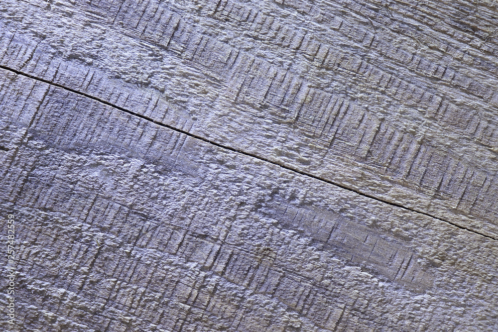 Fototapeta premium Aged in the rain and snow and burnt out in the sun rays board made of natural wood.