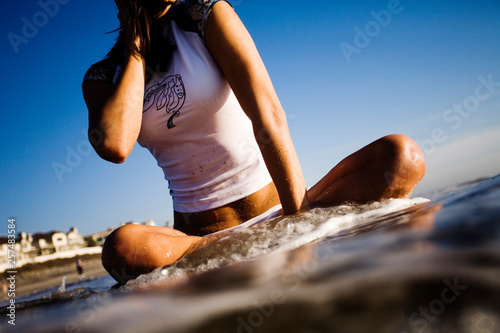 A young brunette women enjoys the beach.  (releasecode: 20070216_1) photo