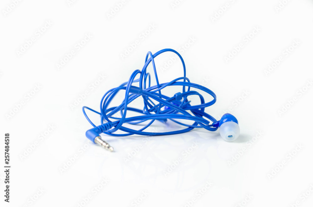 tangled blue no brand earphones isolated on white tangled blue no brand earphones isolated on white