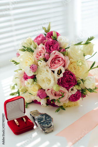 beautiful wedding bouquet with gold rings, bridal accessories