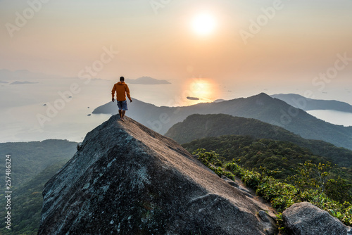 Man trekking on top of Ilha Grande at sunrise photo
