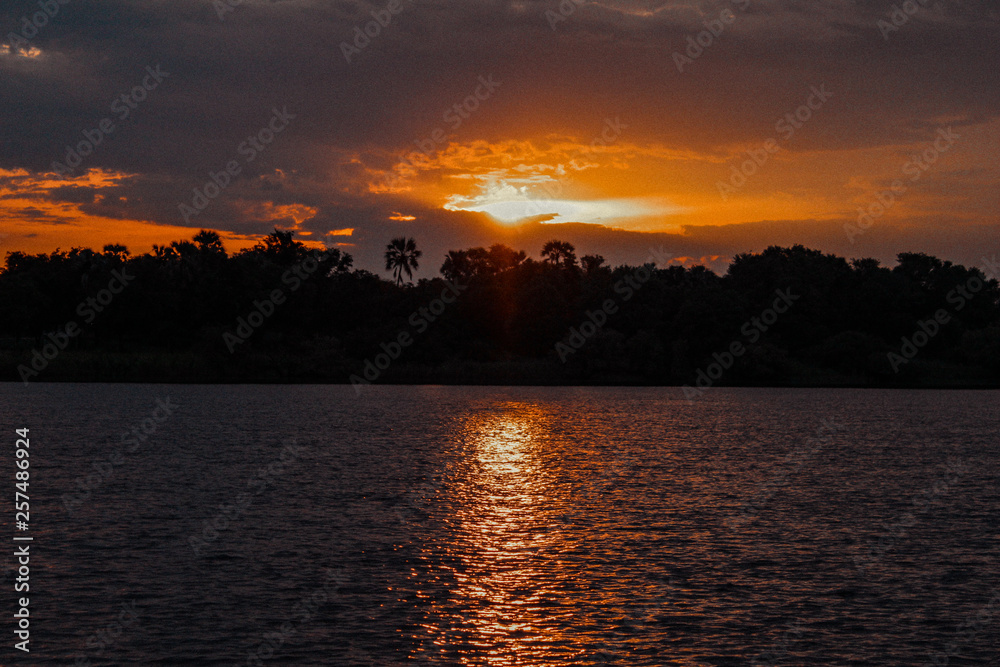 sunset , zambezi river, zambia, zimbabwe