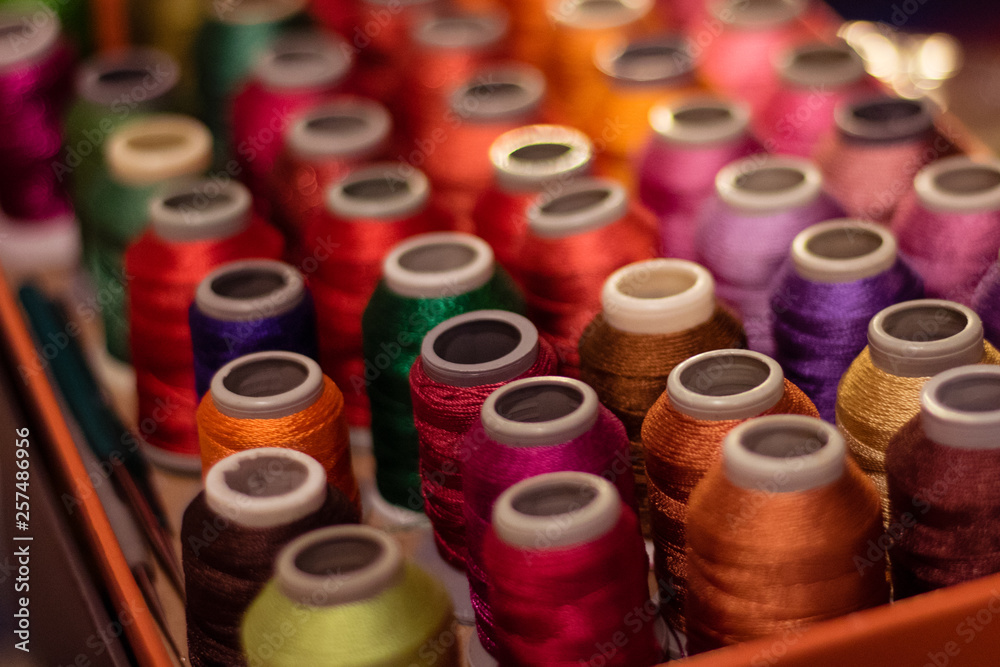 colorful spools of thread colorful spools of thread