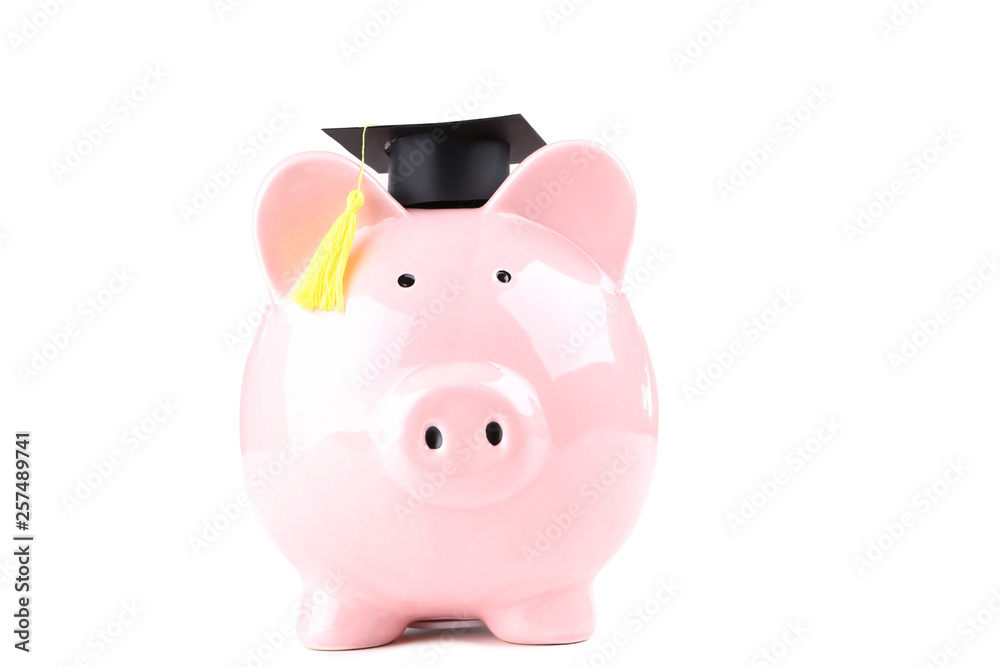 Piggybank with graduation cap isolated on white background Piggybank with graduation cap isolated on white background