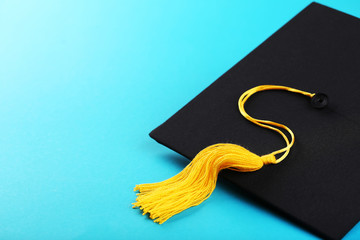 Graduation cap on blue background