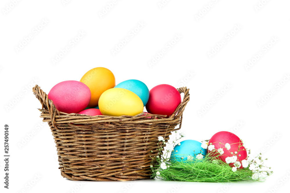 Easter eggs in basket with gypsophila flowers isolated on white background Easter eggs in basket with gypsophila flowers isolated on white background