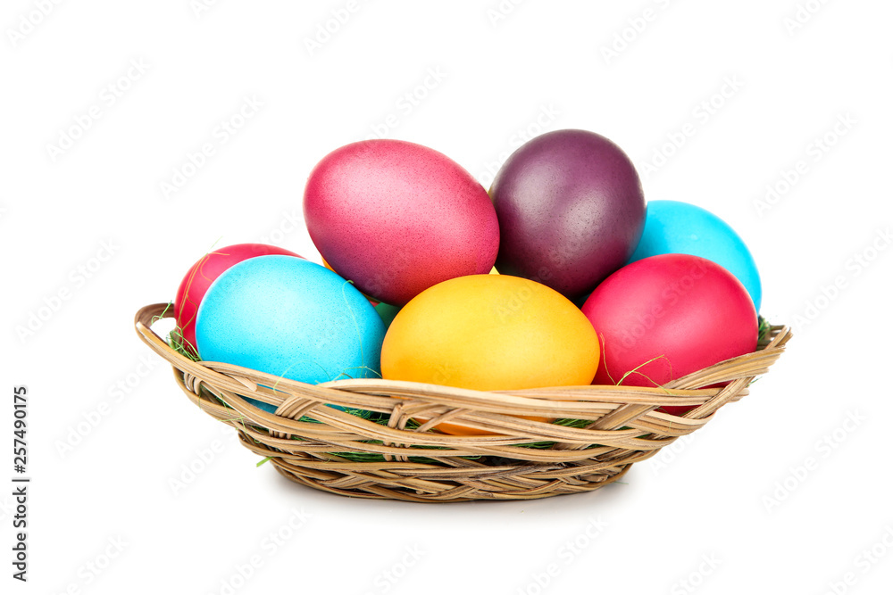 Easter eggs in basket isolated on white background Easter eggs in basket isolated on white background