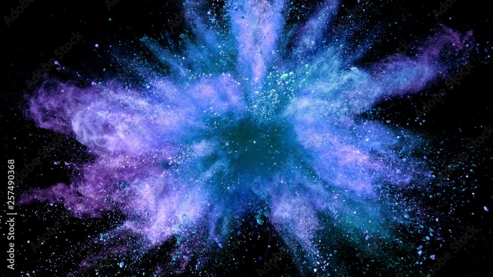 Super slowmotion shot of color powder explosion isolated on black background.