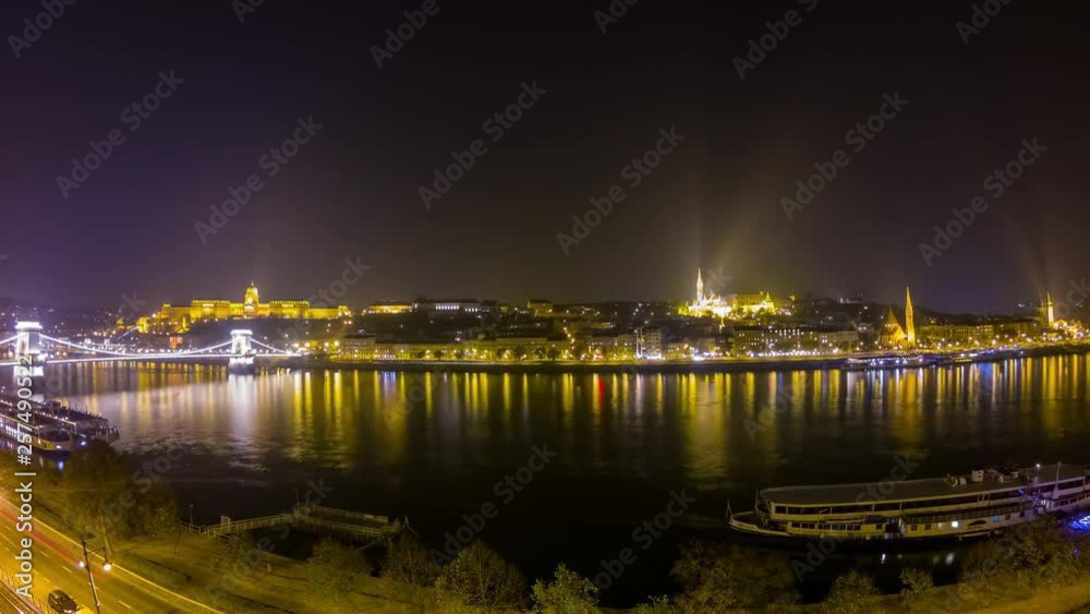 Night time lapse of the famous River Danube, Chain Bridge, Matthias Church and cityscape Night time lapse of the famous River Danube, Chain Bridge, Matthias Church and cityscape
