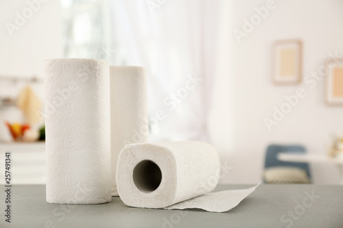 Quadro su tela Rolls of paper towels on table in kitchen