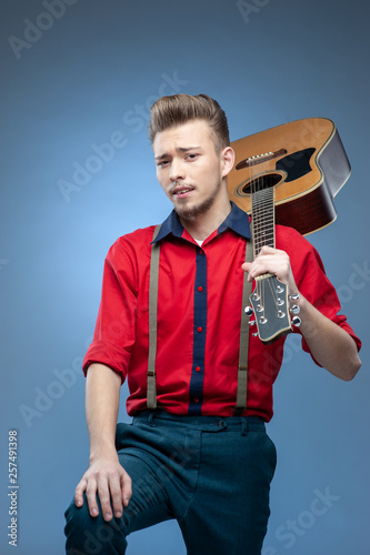 Young man dressed in rock'n'roll or rockabilly style.
