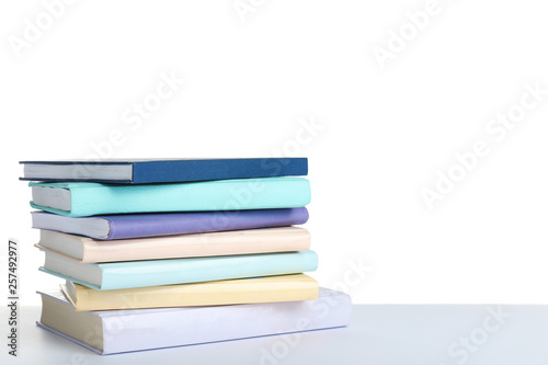 Stack of books on white background. Space for text