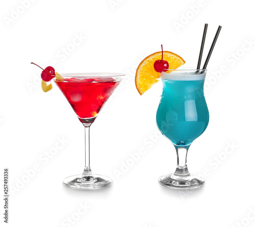 Tasty refreshing cocktails in glasses on white background