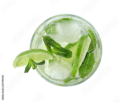 Fotografija Glass of tasty refreshing cocktail on white background, top view