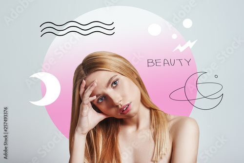 I Am Bored. Young blonde woman looking at camera and keeping hand on head while standing against abstract pink circle and hand drawn illustrations.