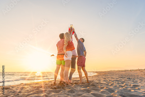 Group of friends enjoy on the beach