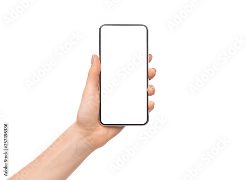 Womale hand holding smartphone with blank screen