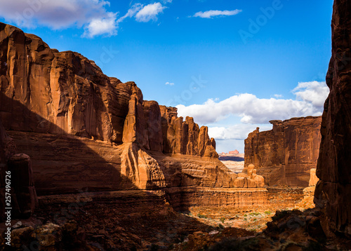 Red rock sandtone canyon near Moab Utah. Large cliffs of orange rock on all sides.